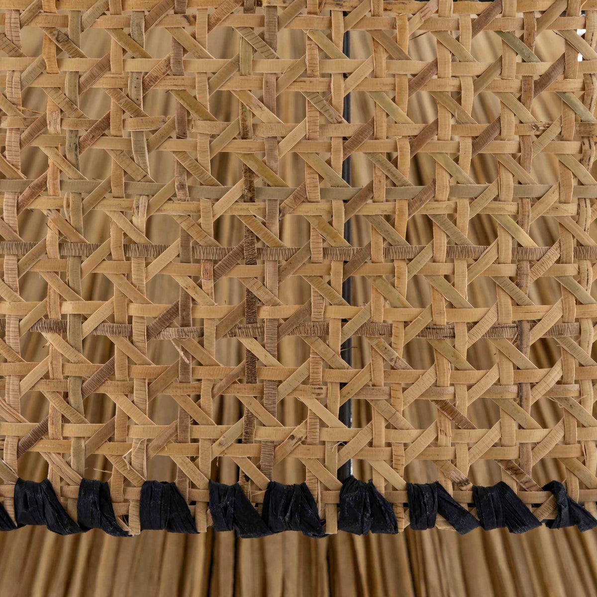 Open lattice weaving and black wrapped trim give the natural drum shade handcrafted appeal
