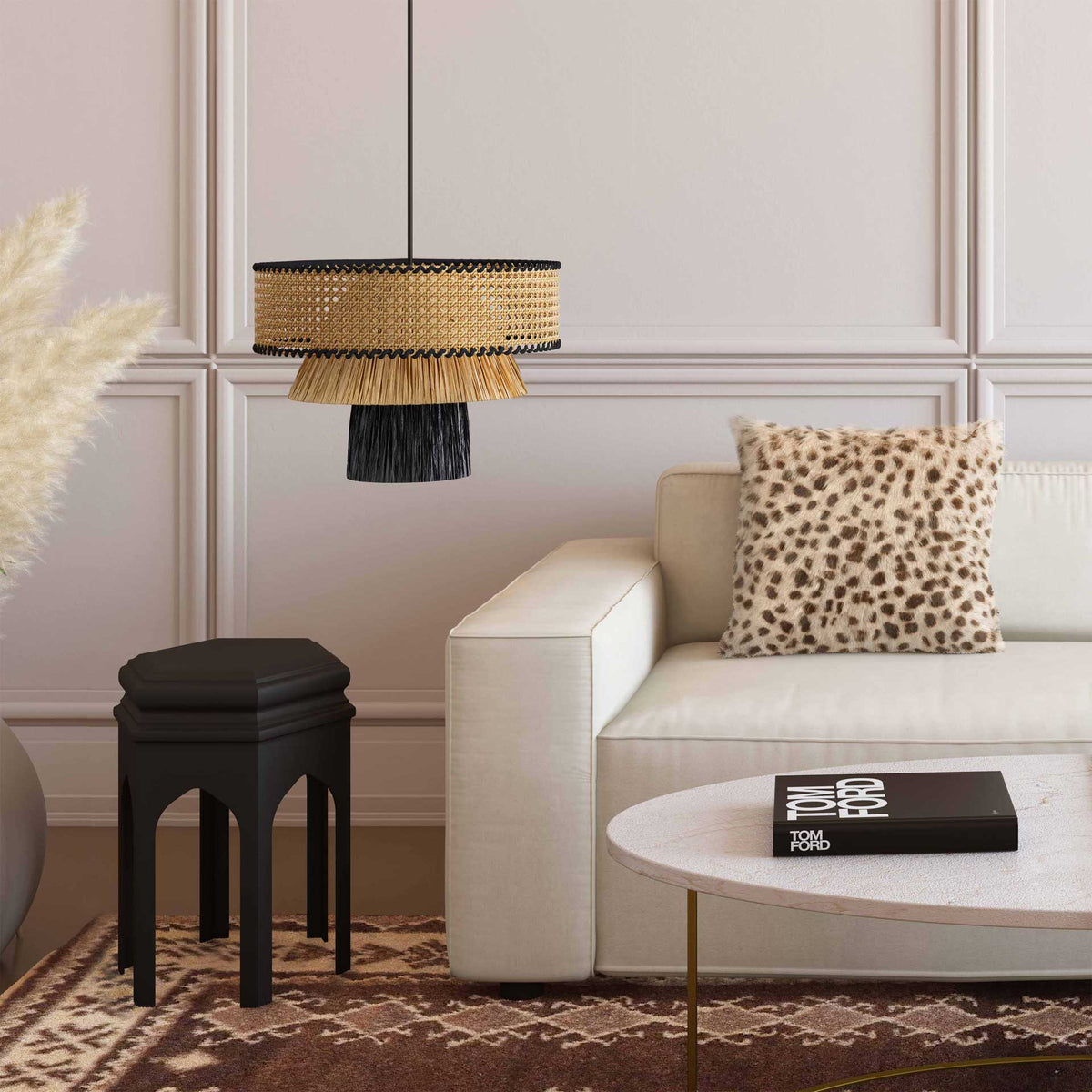 Natural raffia and bold black accents bring warm, sculptural style to a neutral living room