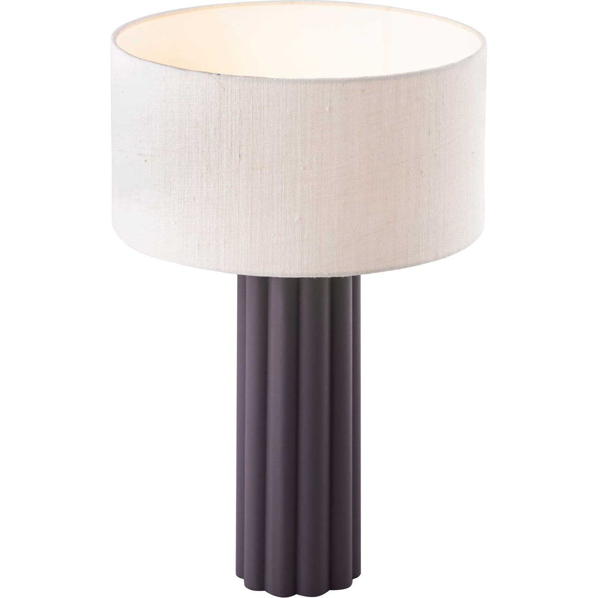A wide linen drum shade pairs a warm glow with a tall charcoal gray column.