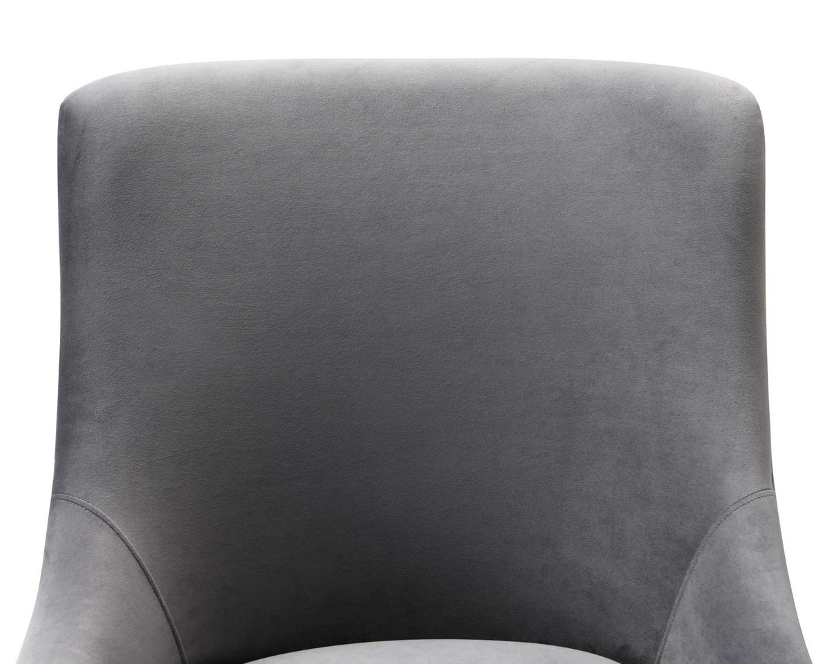 Gray velvet gives the gently rounded backrest a soft sheen, framed by subtle curved seams