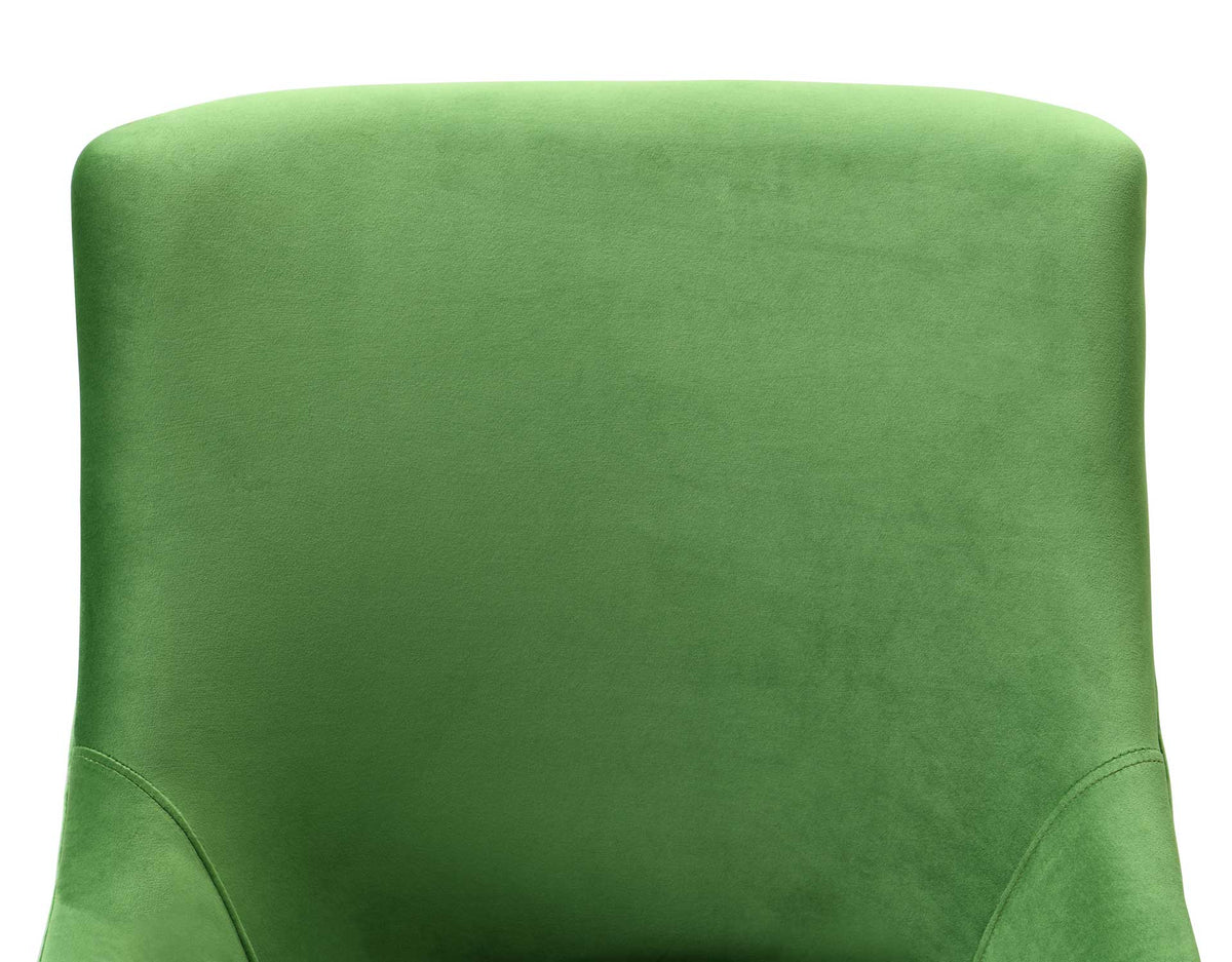 Lush green velvet softens the rounded backrest, with curved seams adding a tailored finish