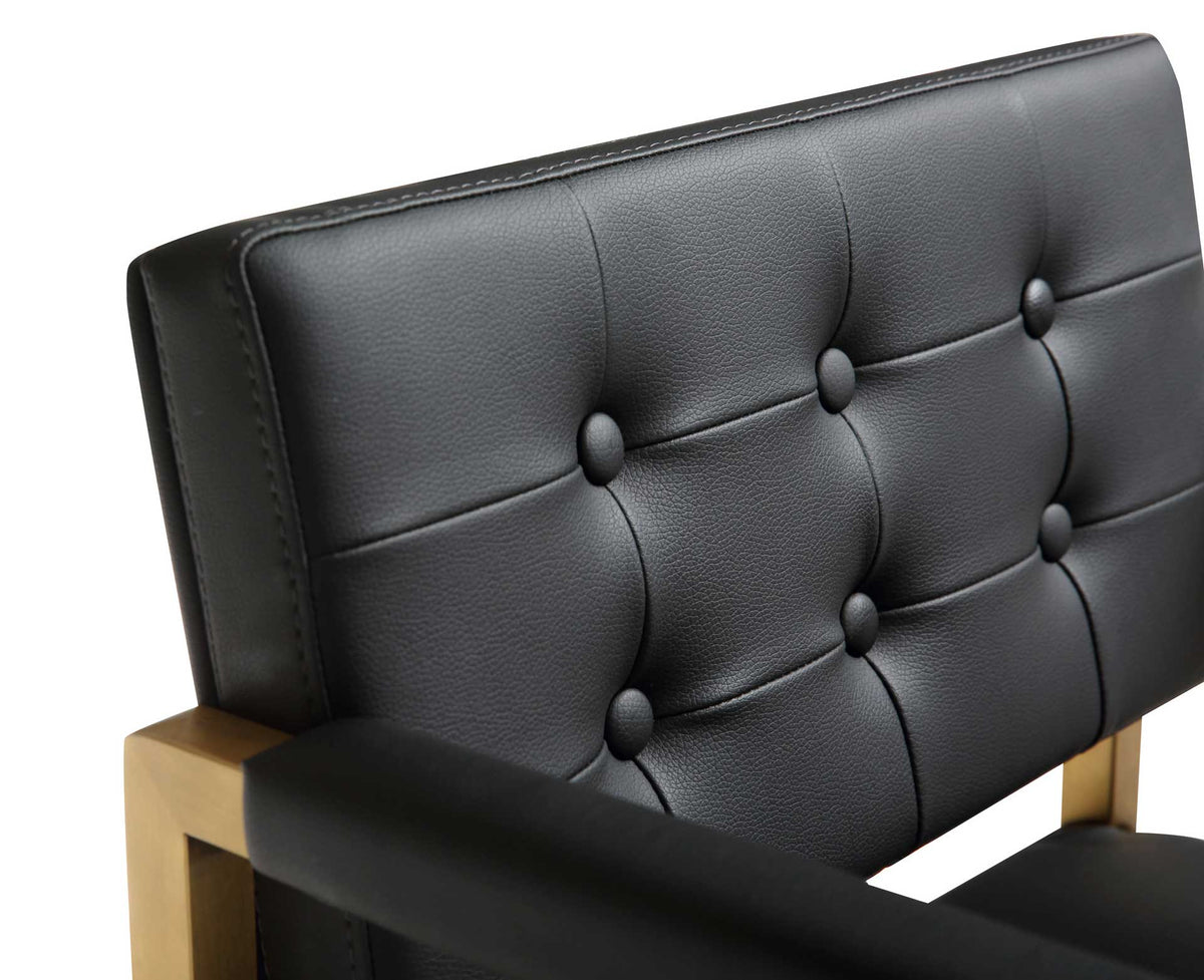 Six covered buttons and stitched panels add plush definition to the black vegan leather back