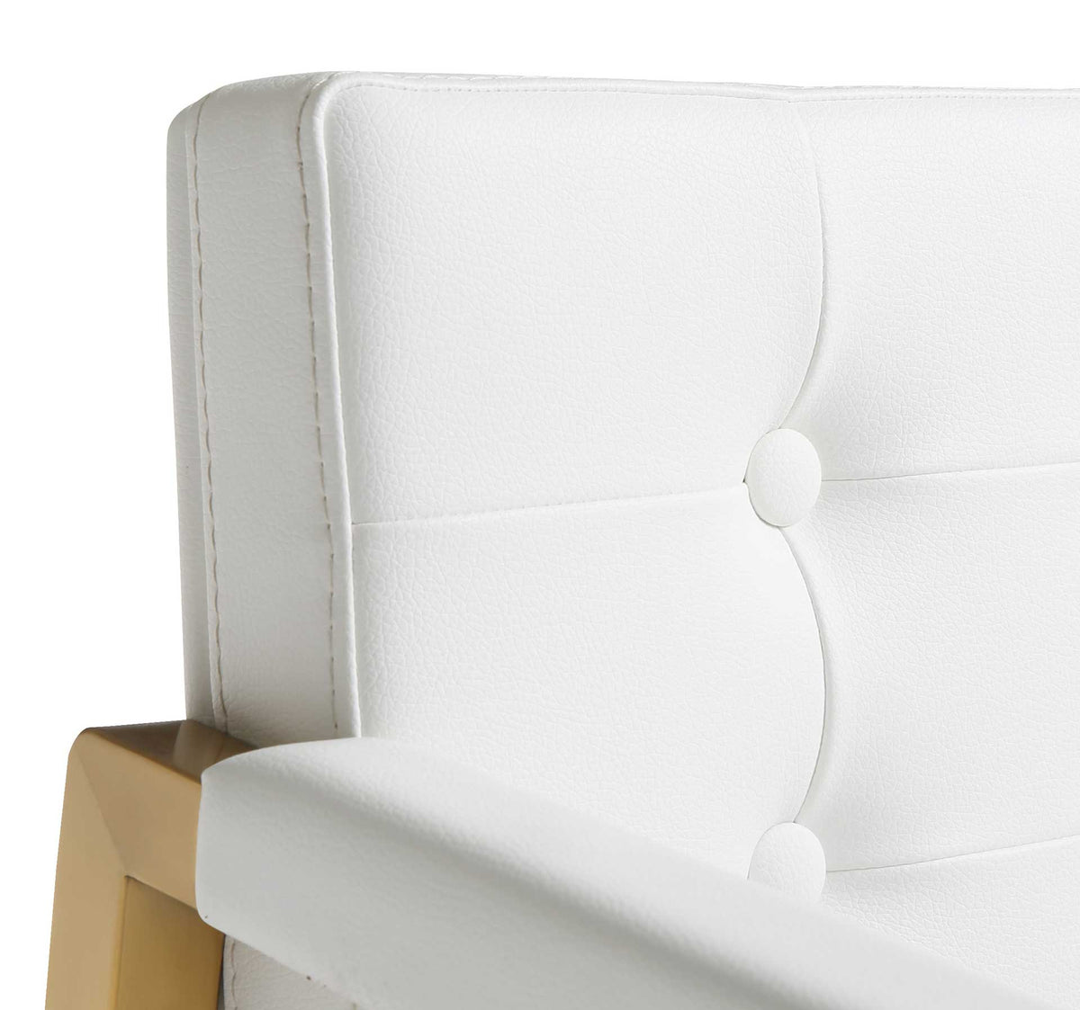 Covered buttons, clean stitching, and white vegan leather create a softly tailored backrest