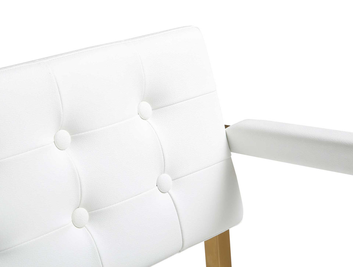 Plush white tufted panels and a padded armrest offer an inviting balance of texture and comfort