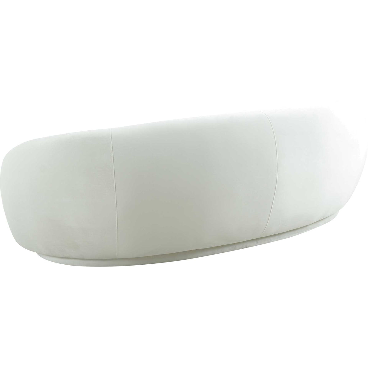 Cream velvet upholstery follows the sofa's rounded back, accented by subtle vertical seams