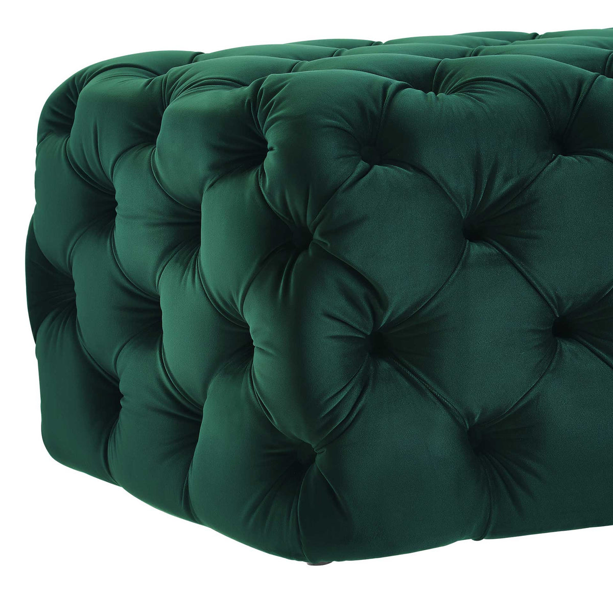 Soft green velvet gathers into deep button tufts for a richly textured, cushioned finish.