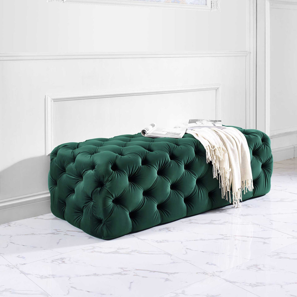 A plush green velvet ottoman pairs deep tufting with a roomy top for a cozy, polished accent.