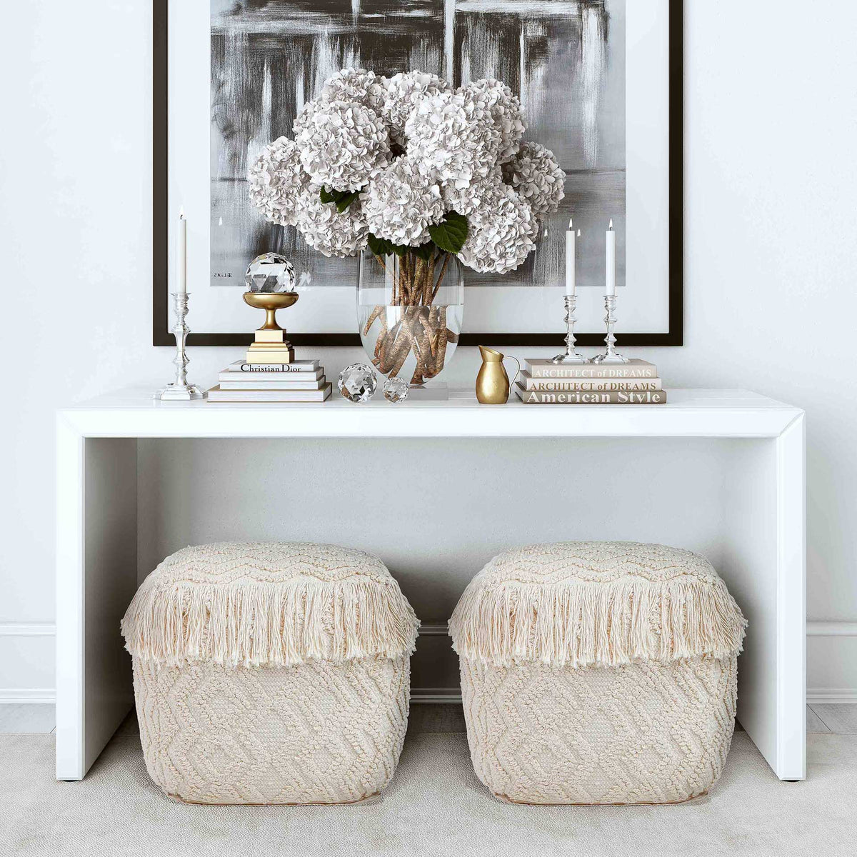 Textured cream poufs tuck neatly beneath a console, bringing cozy seating and relaxed style.