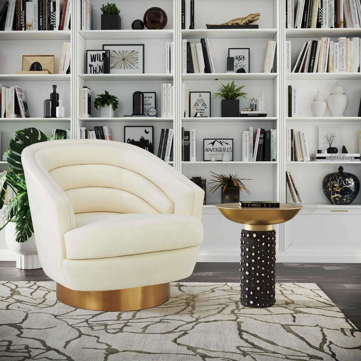 A warm brass top and textured black pedestal make an eye-catching companion to a cozy accent chair.