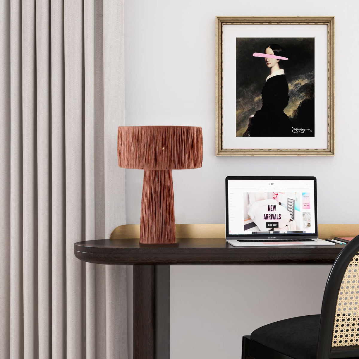 A brown wood-grain desk with a raised brass-finished rail makes an inviting laptop workspace