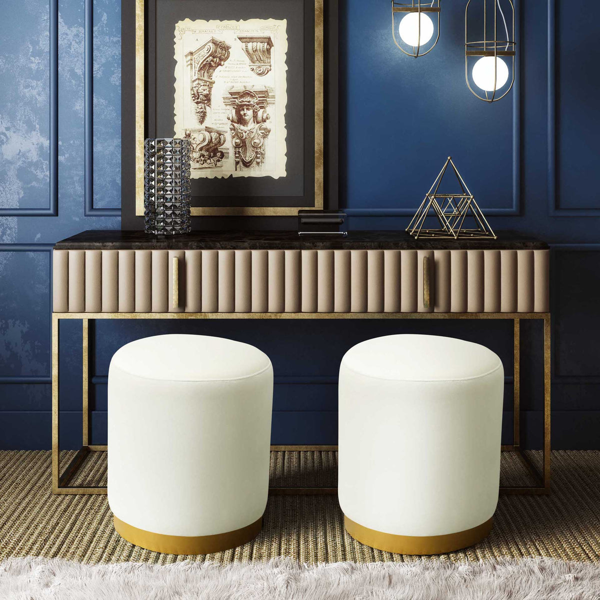 Cream velvet ottomans with warm gold bases bring inviting softness to a refined space.