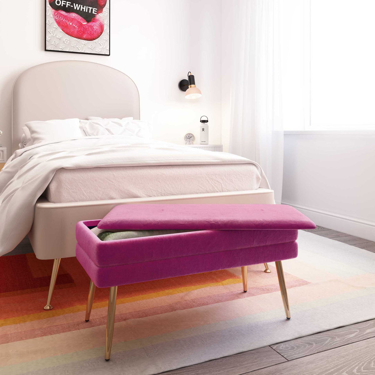 A plum velvet bench adds a rich accent at the foot of the bed, with a cozy throw stored under its padded lid