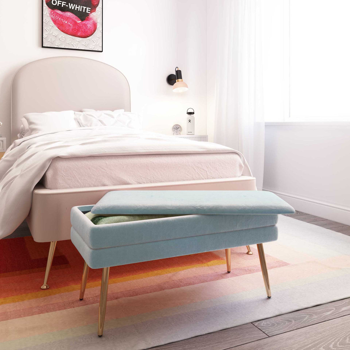 A sea blue velvet bench offers soft bedroom seating and a handy place to tuck a cozy throw