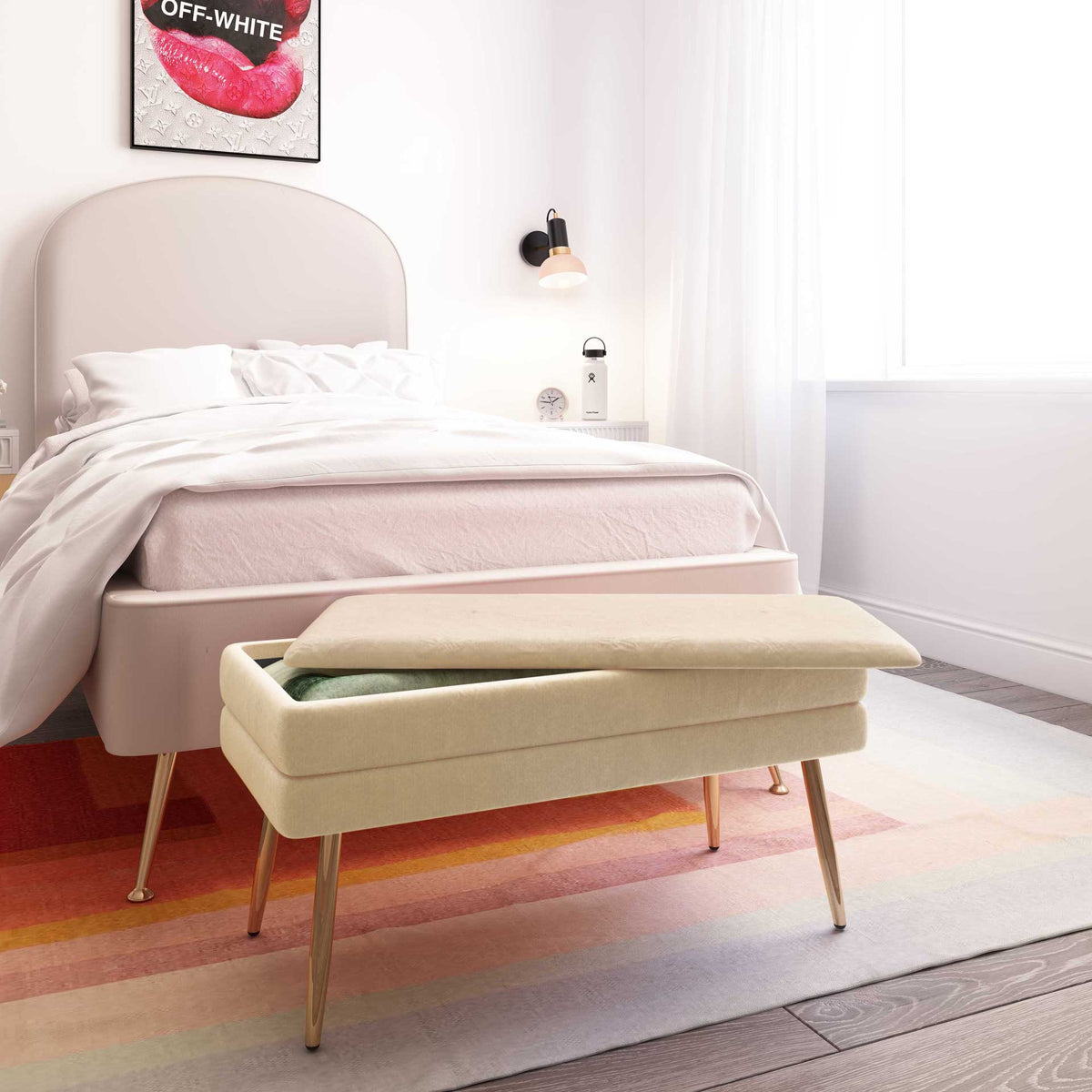 A cream velvet bench brings extra seating and discreet blanket storage to the foot of the bed