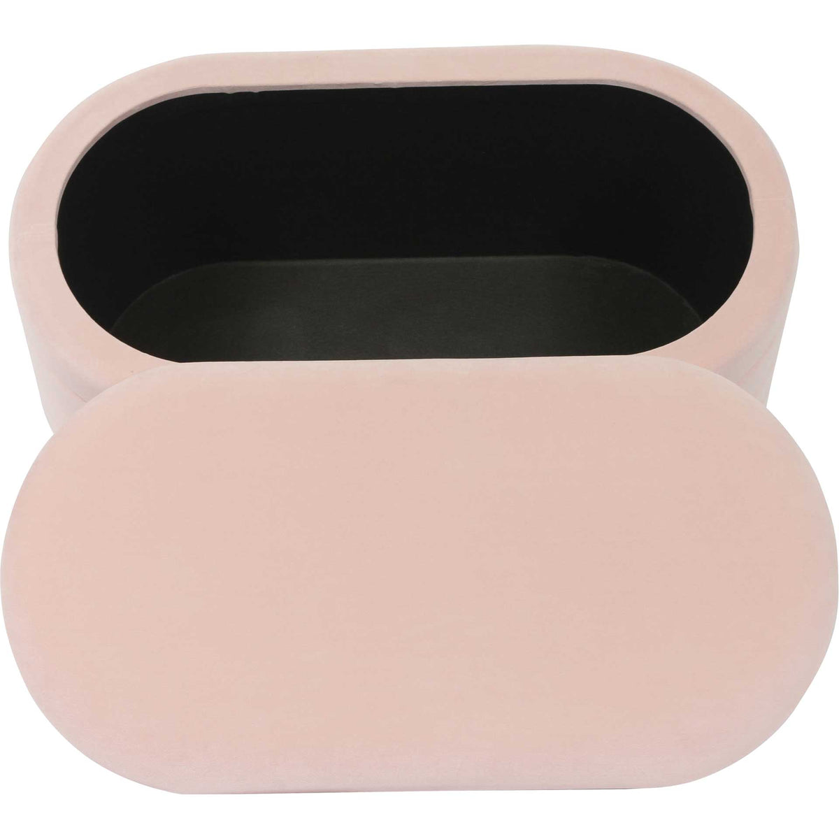 A generous black-lined compartment sits beneath the cushioned blush velvet lid for discreet everyday storage