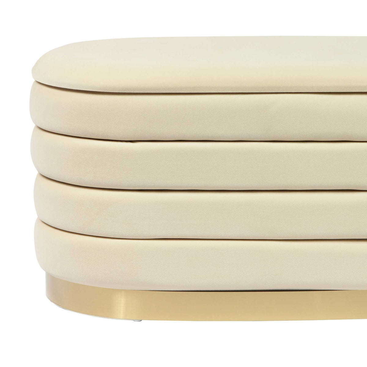 Cream velvet's soft texture and deep horizontal channels add inviting contrast to the gold-tone base