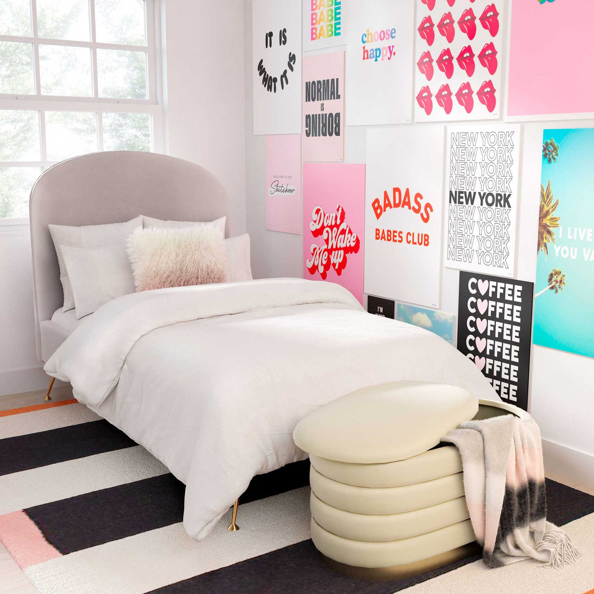 Cream velvet, hidden storage, and a gold-tone base make a practical, glamorous accent at the foot of the bed