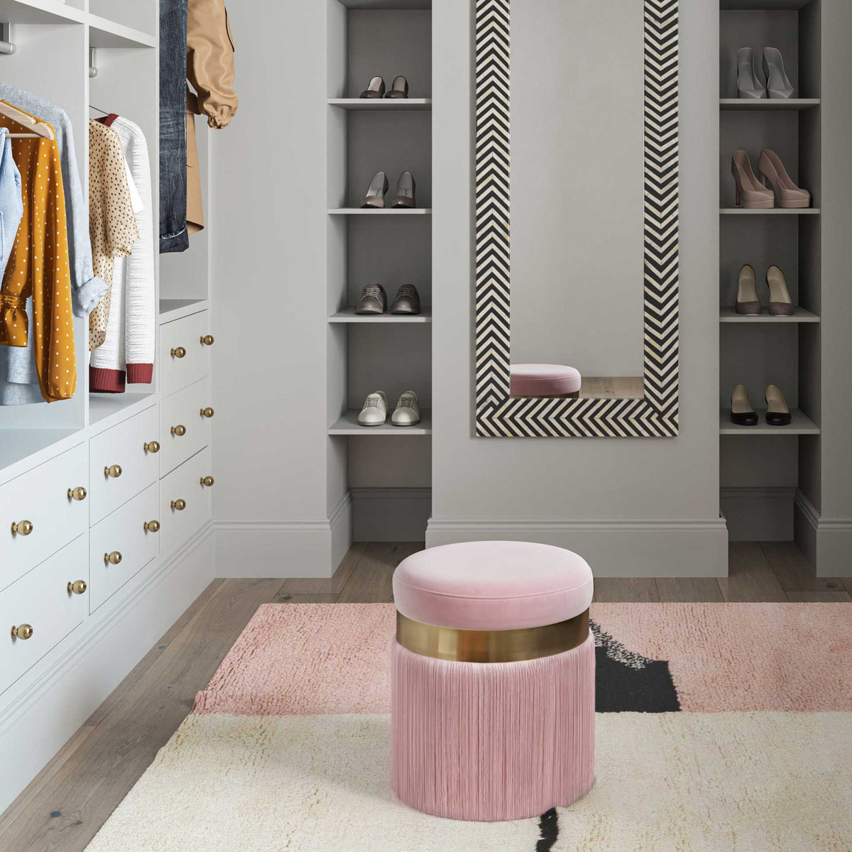 Blush velvet and cascading fringe make a charming extra seat for a stylish dressing space