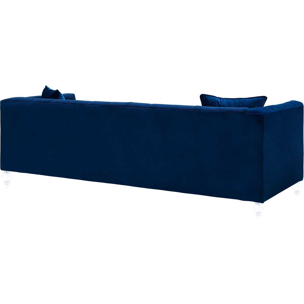 Smooth navy velvet wraps the sofa's tailored back and sides, elevated by clear sculpted feet