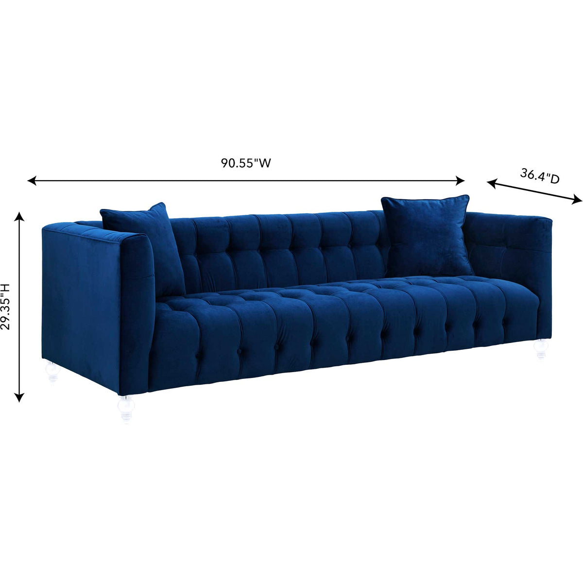 Wide navy velvet sofa combines a deep tufted seat, matching pillows, and a sleek low-profile frame