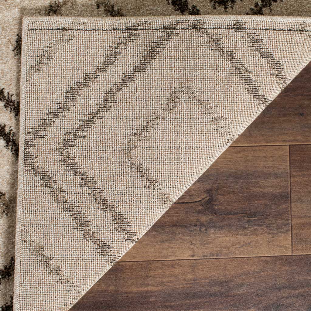 Woven jute backing supports a soft cream pile patterned with brown diamonds.