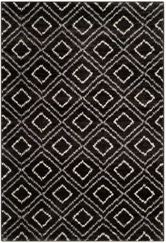 Layers of cream diamonds lend depth and contrast to this soft charcoal rug.