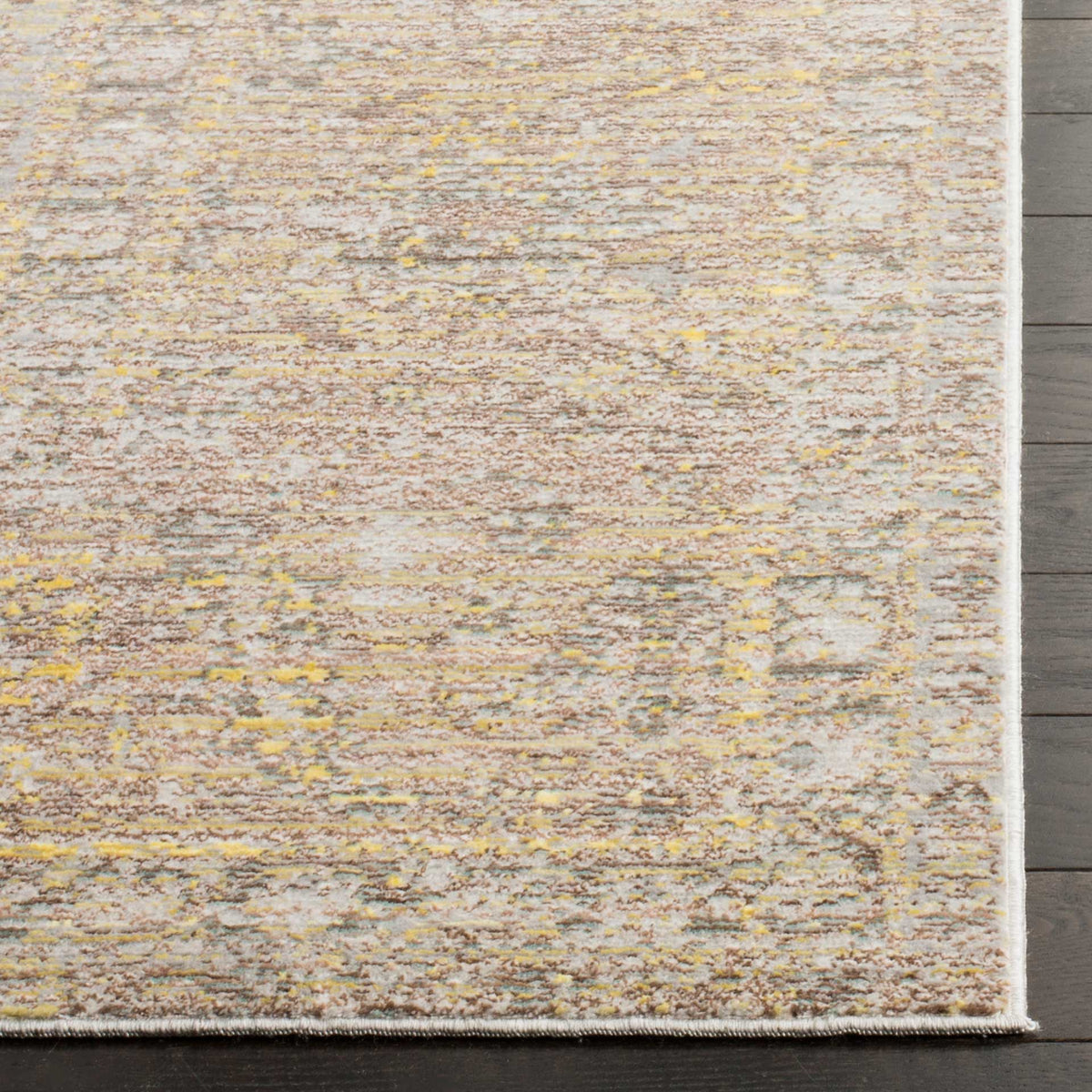 Gold flecks enliven the distressed gray pattern beside a neatly bound edge.