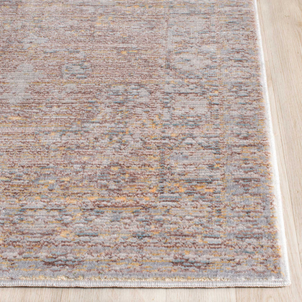 A neatly bound edge frames softly textured gray, taupe and gold tones.