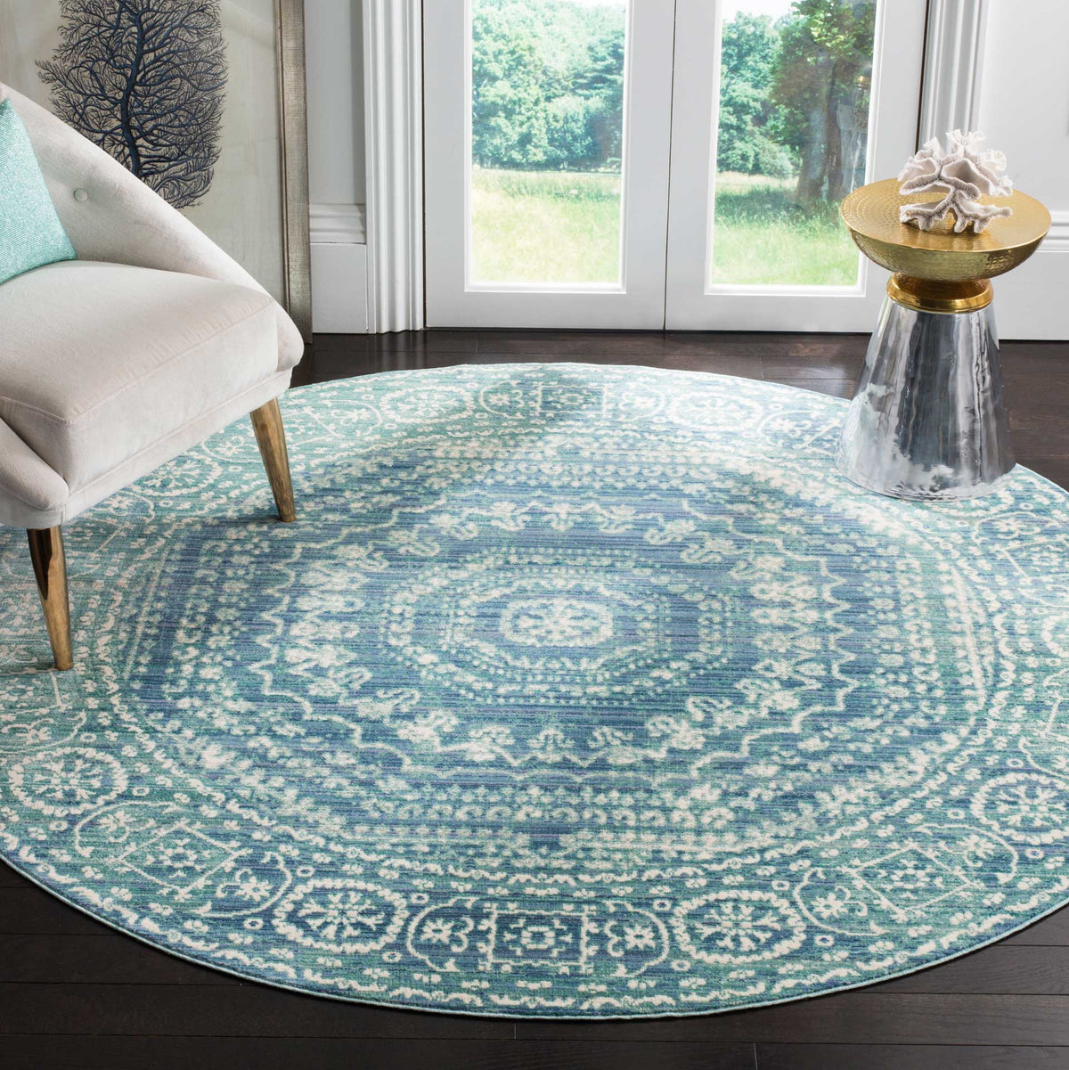 A round blue medallion rug brings intricate pattern and cool color to a bright living room.