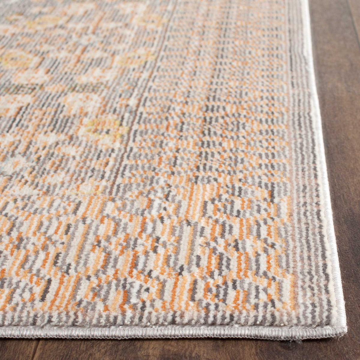 Bound edges frame the runner's detailed gray and peach pattern