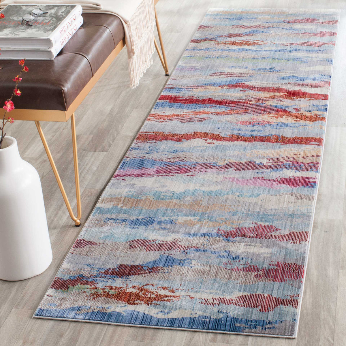 A colorful abstract runner adds layered red and blue tones to a modern interior