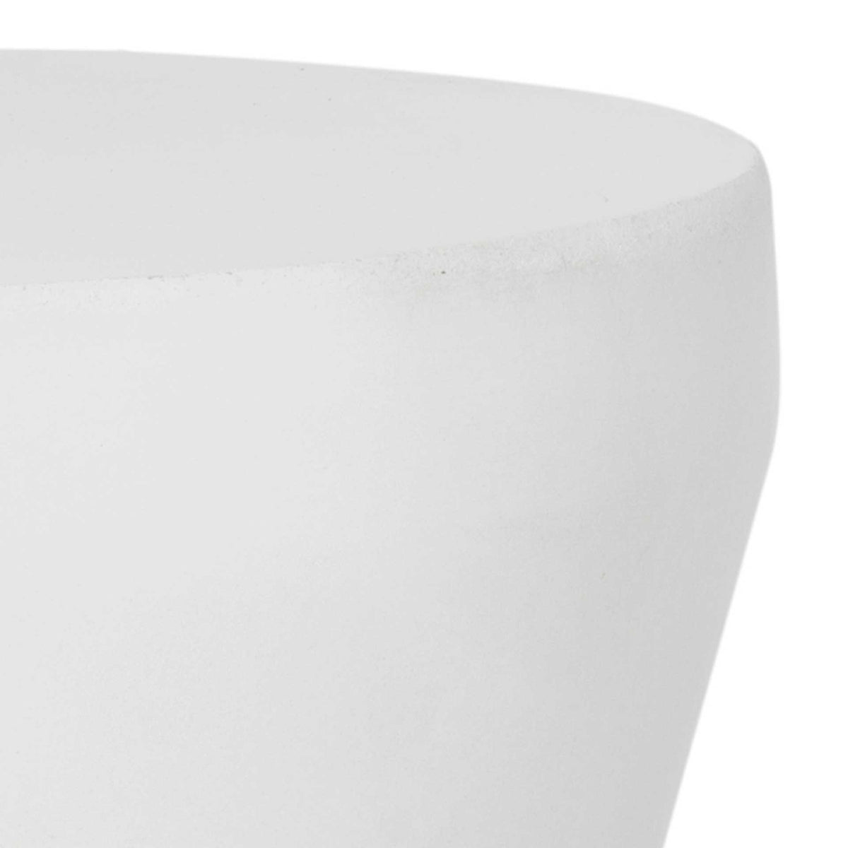 Rounded tabletop edge and smooth ivory concrete surface lend a soft finish to the table