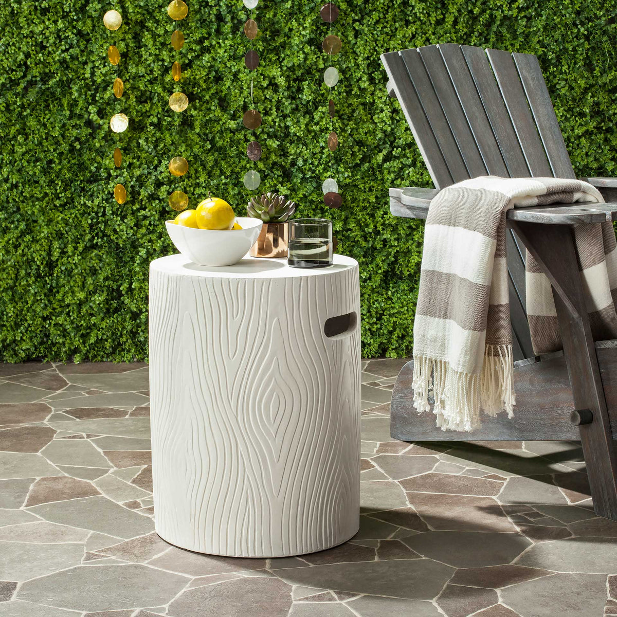 Ivory concrete table brings wood-grain texture and a convenient handhold to patio seating