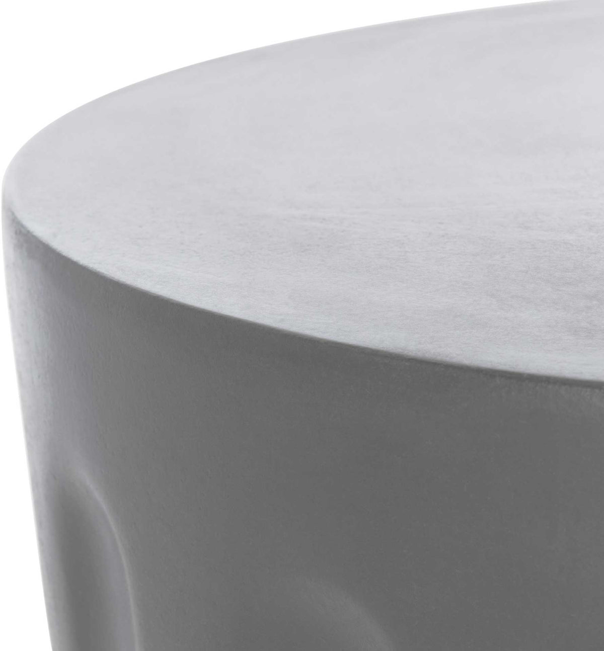 Smooth dark gray tabletop has a gently rounded edge above sculpted concrete sides