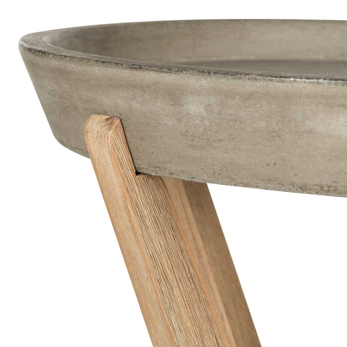 Textured concrete meets brushed wood at the tray rim, highlighting the table's mixed-material construction.