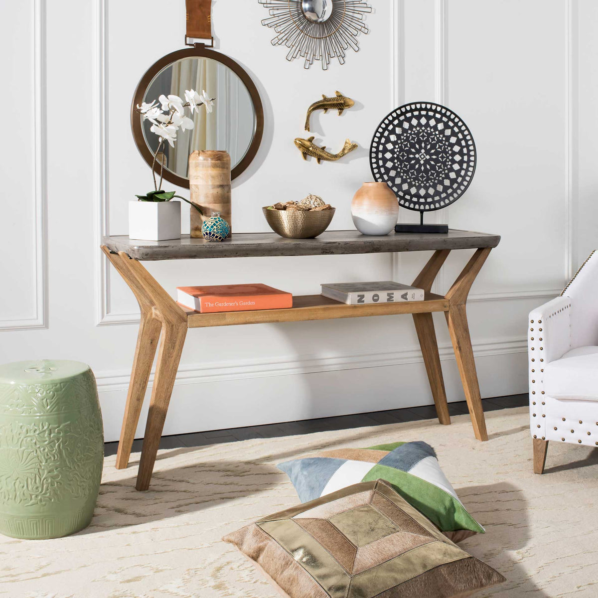 A concrete-and-wood console offers a versatile surface for decor and an open shelf for books.