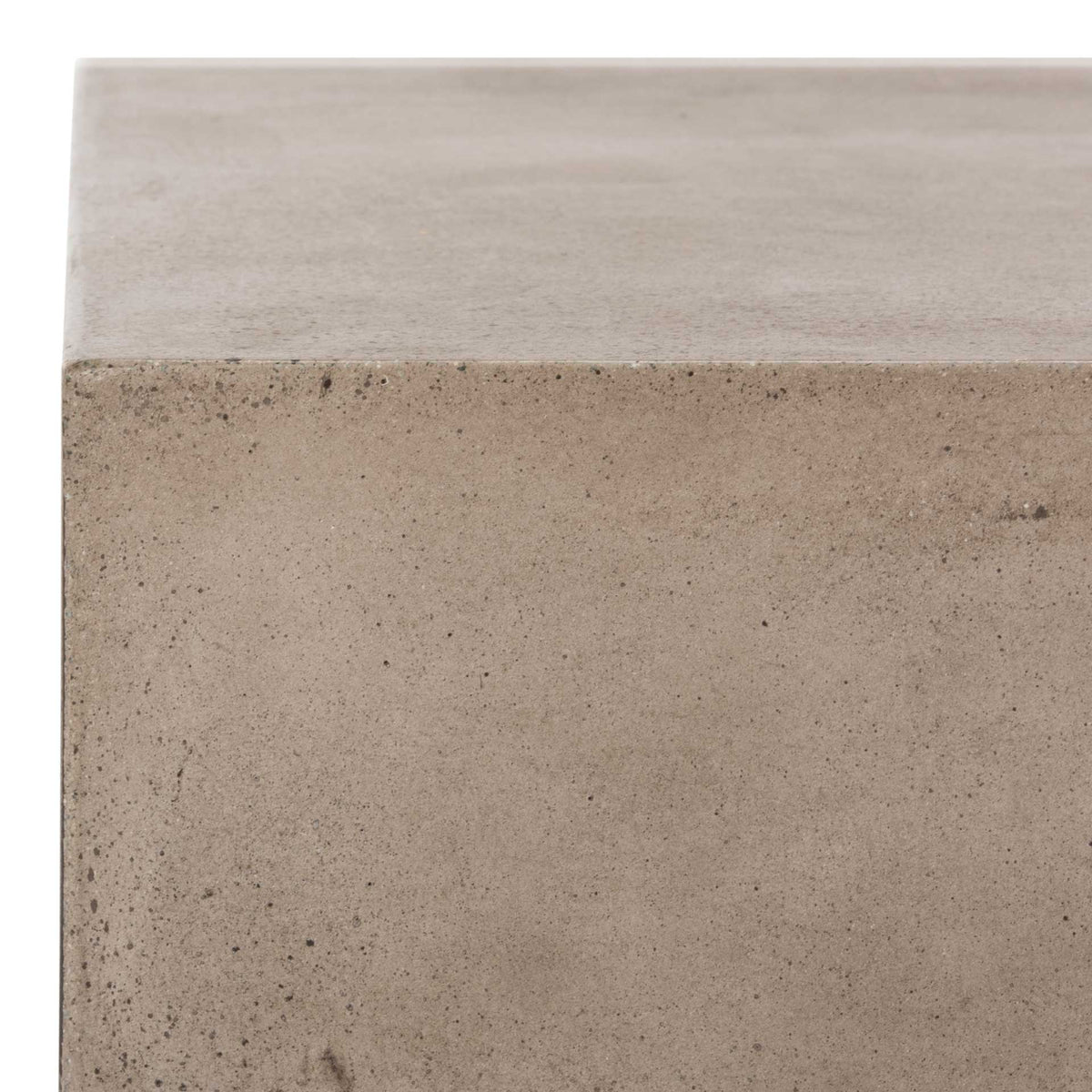 A smooth tabletop meets a subtly textured concrete edge for a tactile, modern finish.