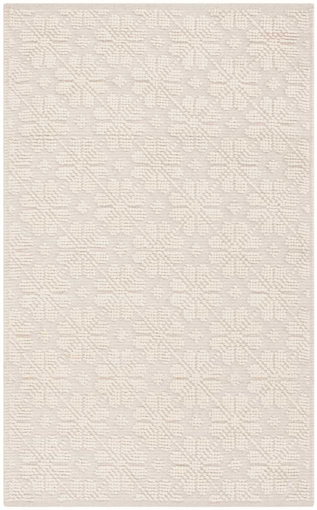 Compact ivory rug with a raised geometric motif that brings subtle dimension to any space