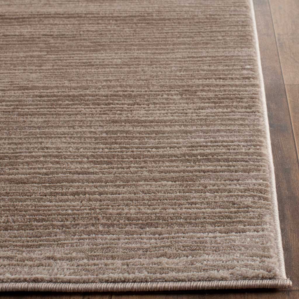 Light brown pile and a bound corner show soft tonal variation