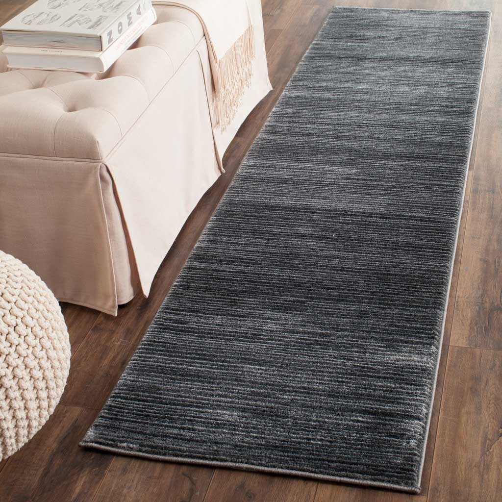 Charcoal gray runner adds depth and understated texture to hardwood floors