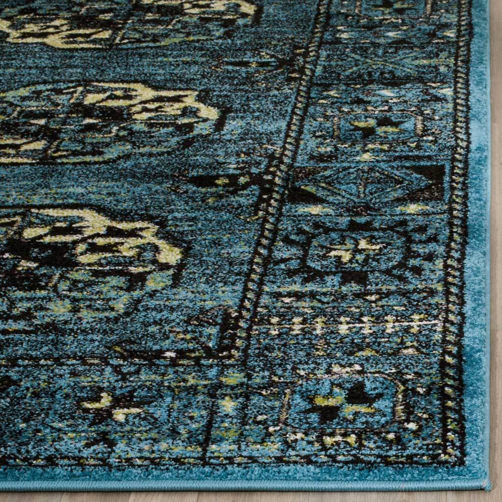 Turquoise-bound edge frames textured blue pile and intricate cream motifs