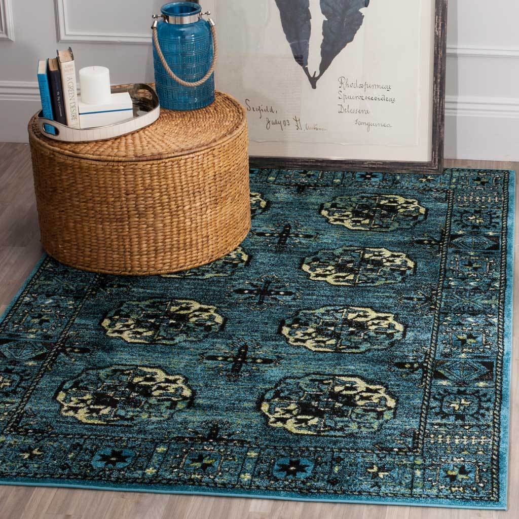 Blue medallion rug adds vivid pattern beneath a woven round accent table