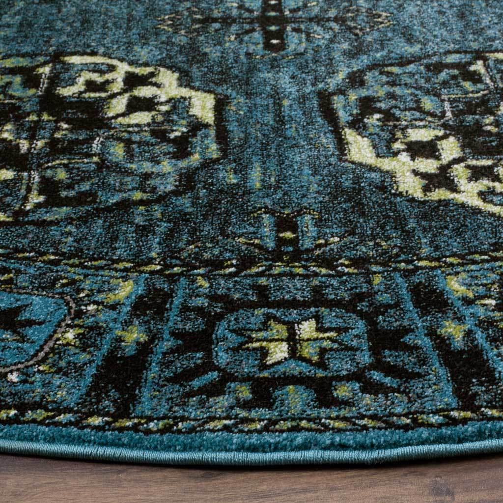 Blue and cream motifs meet a dark geometric border and neatly bound curved edge.