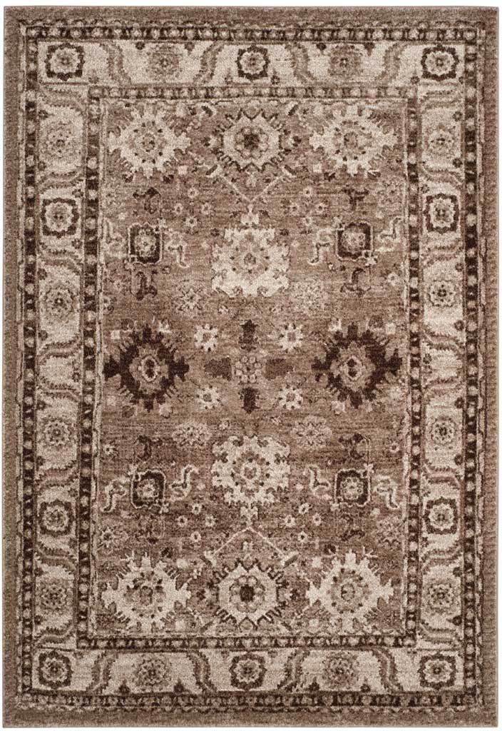 Taupe rug layers ivory floral motifs over a gently distressed field