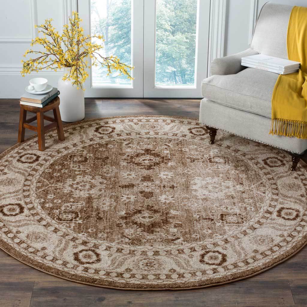 A neutral taupe palette and faded floral details soften this round rug beside a pale chair.