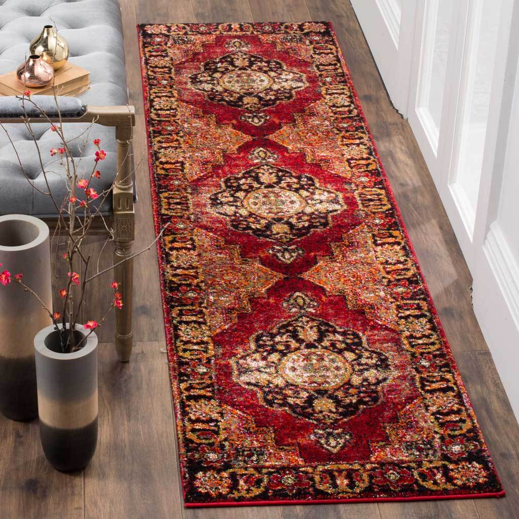 Vivid red runner with layered gold and ivory medallions framed by patterned edges