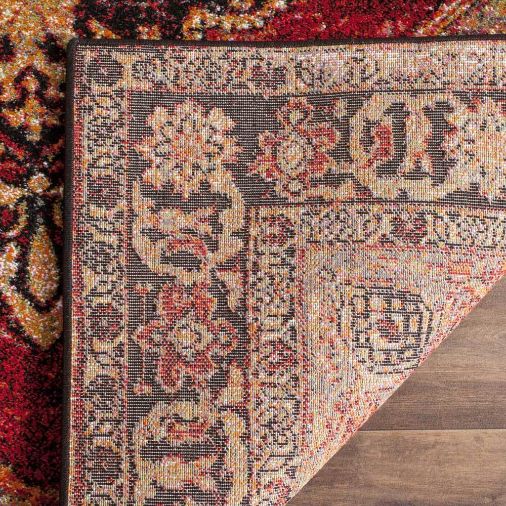 Detailed floral reverse weave highlights the rug's rich red and neutral backing
