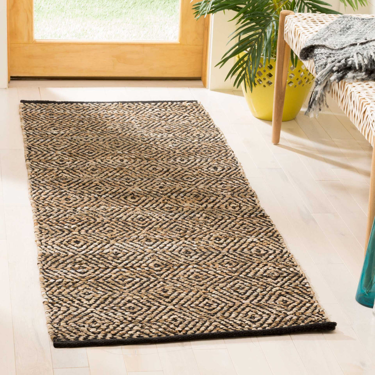 Beige and black woven runner pairs crisp geometric diamonds with a neat, dark edge