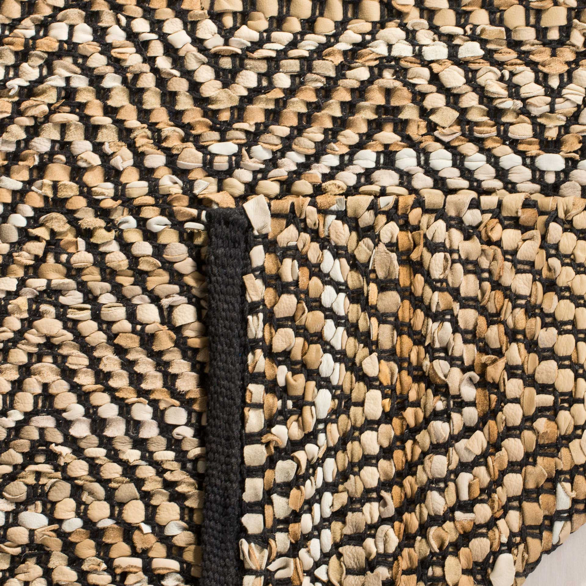 Folded reverse highlights the dense black and beige chevron weave