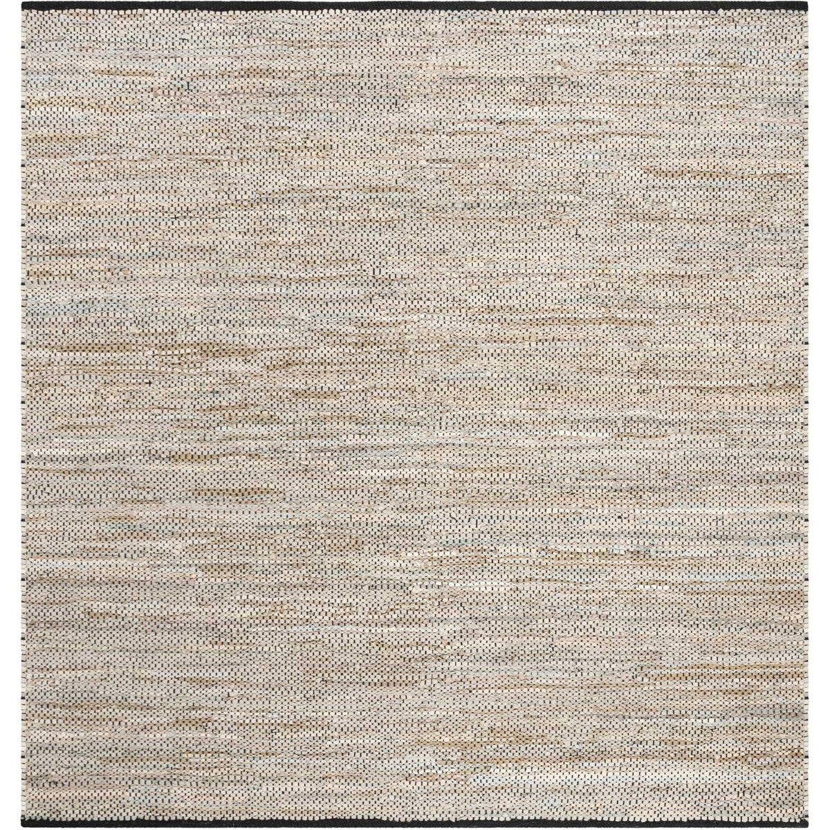 Square beige rug brings gentle tonal texture and contrasting dark trim